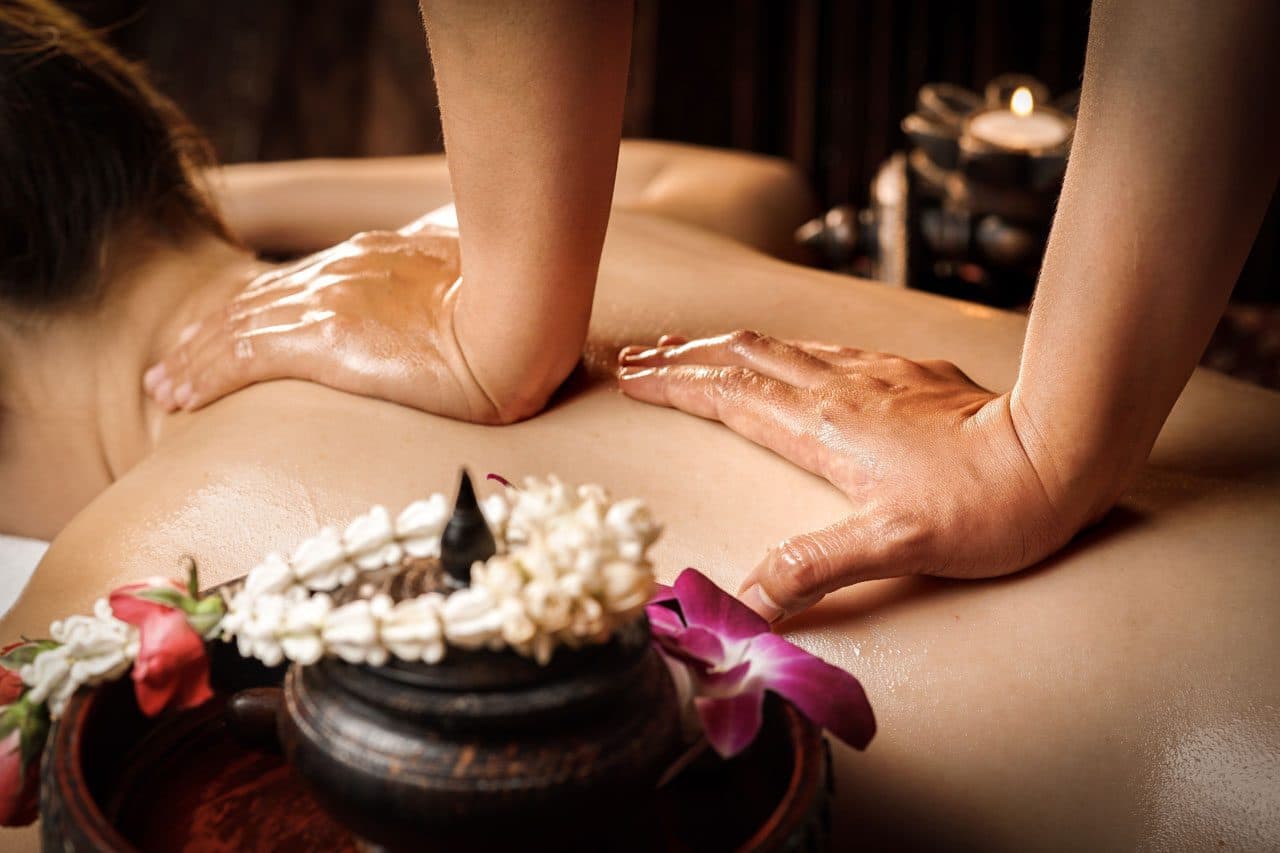 Close-up of firm pressure being applied during a deep tissue back massage